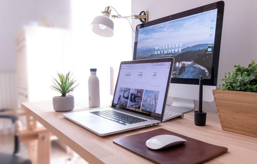 A developer workspace with laptop and monitor